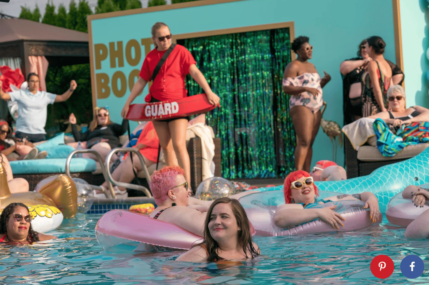 A scene of people at a pool party. A lifeguard in red shirt with sunglasses holding a lifeguard floatie is looking into a pool full of people in water and on floaties
